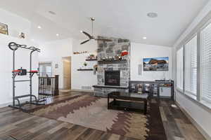 Main Family Room w/ stone fireplace & vaulted ceilings.