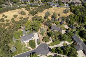 Aerial view of property's location with nearby suburban area