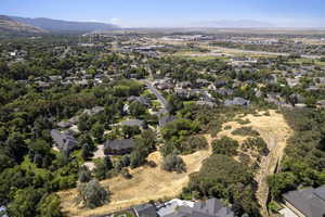 Aerial perspective of suburban area featuring a mountainous background