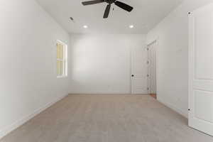 Unfurnished room featuring light carpet, recessed lighting, and a ceiling fan