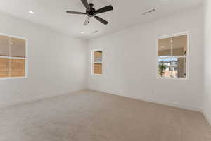 Unfurnished room featuring light carpet, recessed lighting, and ceiling fan
