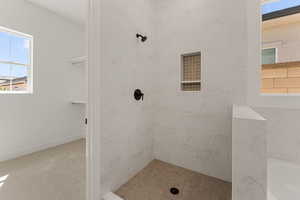 Full bathroom featuring tiled shower and a tub