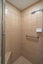 Bathroom featuring a tile shower