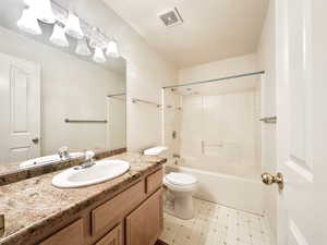 Bathroom featuring vanity and bathing tub / shower combination