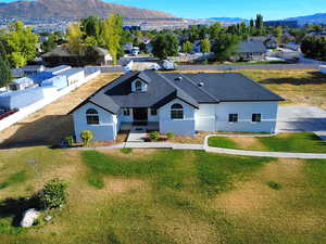 View of front of home featuring a mountain view, stucco siding, and a residential view