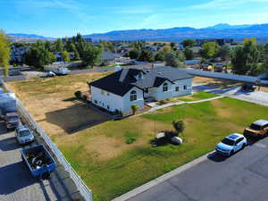 Aerial perspective of suburban area featuring a mountain backdrop