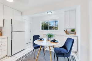 Dining room with light tile patterned floors