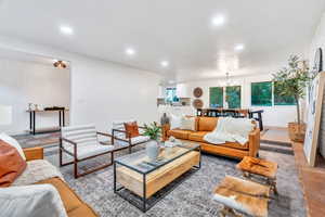 Living room featuring recessed lighting and a chandelier