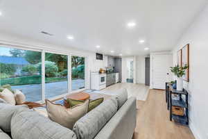 Living area featuring recessed lighting and light wood-style floors