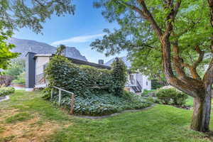 View of grassy yard featuring a mountain view