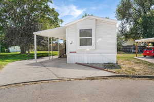 View of front of home featuring a shed