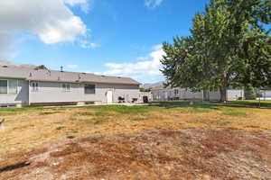 Rear view of property featuring a patio