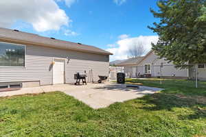 Back of house with a patio area