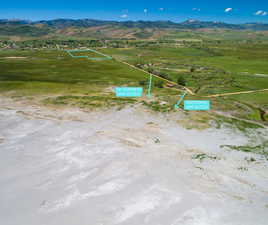 Overview of rural landscape featuring a mountainous background
