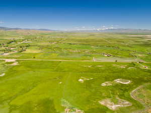 Aerial view of sparsely populated area featuring a mountain backdrop