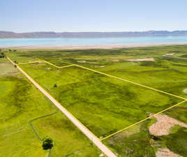 Overview of rural landscape featuring a water and mountain view and property boundaries highlighted