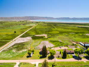 Aerial view of sparsely populated area featuring a water and mountain view