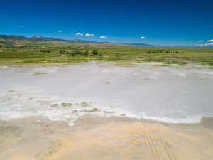 View of mountain backdrop with rural landscape