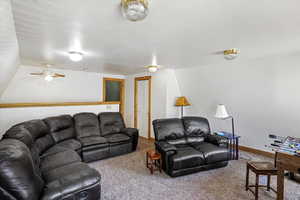 Living room featuring carpet floors and baseboards