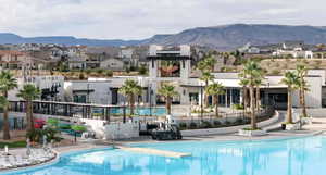 Community pool featuring a mountain view and a residential view