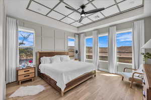 Bedroom featuring light wood-style flooring and a ceiling fan