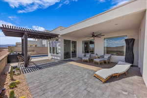 View of patio / terrace featuring a pergola, an outdoor hangout area, and a ceiling fan