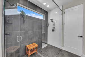 Full bathroom with a shower stall and tile patterned flooring