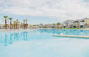 Community pool with a residential view