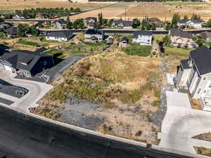 Aerial view of property's location featuring nearby suburban area