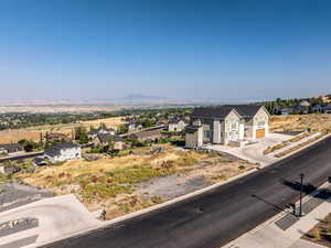 Aerial perspective of suburban area featuring a mountainous background