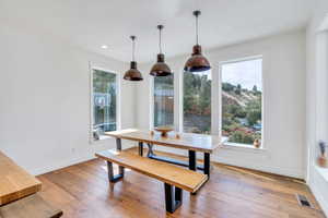 Dining room featuring hardwood / wood-style floors and recessed lighting