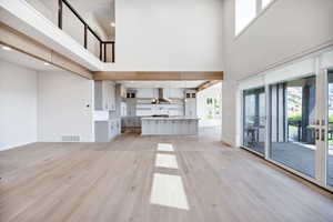 Unfurnished living room with light wood-style floors and recessed lighting