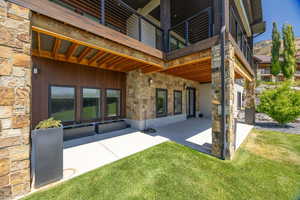 Patio / terrace with a patio and a lawn