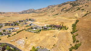 Aerial view of property's location featuring mountains and rural landscape