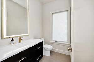 Bathroom with vanity and tile patterned floors