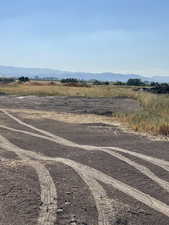 View of street with a rural view and a mountain view