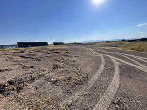 View of dirt / gravel road with a rural view