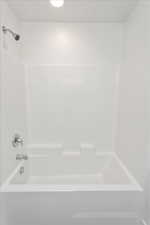 Full bathroom with shower / tub combination