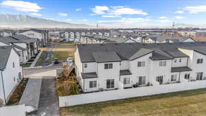 Aerial view of residential area featuring a mountain backdrop