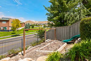 View of patio featuring a garden and a residential view