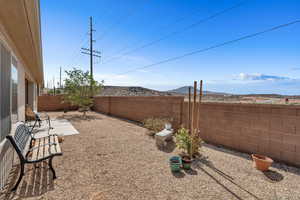 Fenced backyard with a patio area and a mountain view