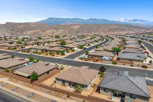 Aerial perspective of suburban area featuring a mountain backdrop