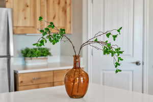 Dining area view of freestanding refrigerator