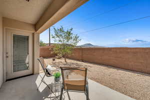 Fenced backyard featuring a patio