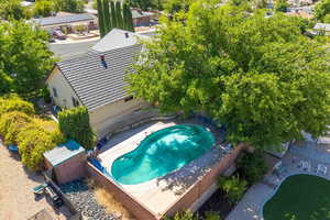 View of subject property with a pool