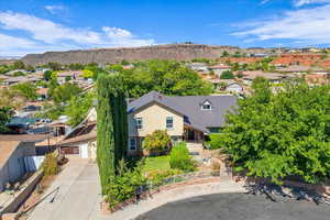 Aerial perspective of suburban area with a mountainous background
