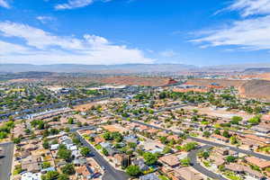 Aerial perspective of suburban area with a mountain backdrop