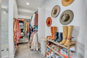 Spacious closet with carpet floors