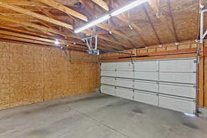 Garage featuring a garage door opener