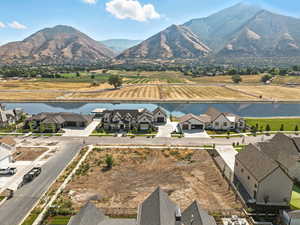 Aerial perspective of suburban area featuring a water and mountain view